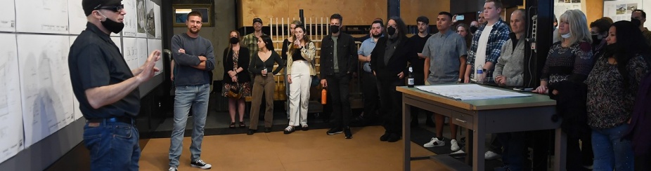 Zoom image: Brad Wales (foreground), clinical assistant professor of architecture at UB, and Andrew Lunetta, executive director of A Tiny Home for Good, address class members during final presentations in May 2022. Photo: Nancy J. Parisi 