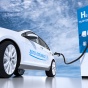 Illustration of a car plugged into a hydrogen fuel station. 