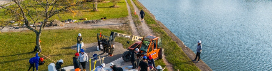 Zoom image: UB architecture students and faculty work on the installation of the Sydney Gross Memorial along the Erie Canal in Medina, N.Y., on Nov. 13. Photo: Douglas Levere 