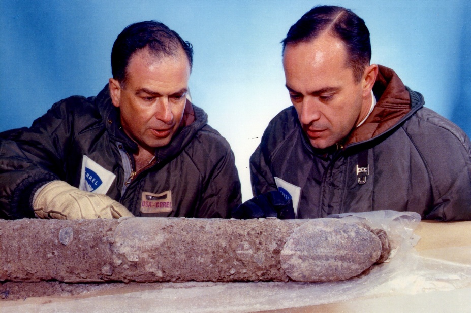 Zoom image: Lyle B. Hansen and Chester "Chet" Langway (right) inspect the sediment found beneath the Camp Century ice core in the 1960s. Langway would take the sediment with him when he joined UB in 1975. Photo: David Atwood, U.S. Army, courtesy of Emilio Segr&egrave; Visual Archives 